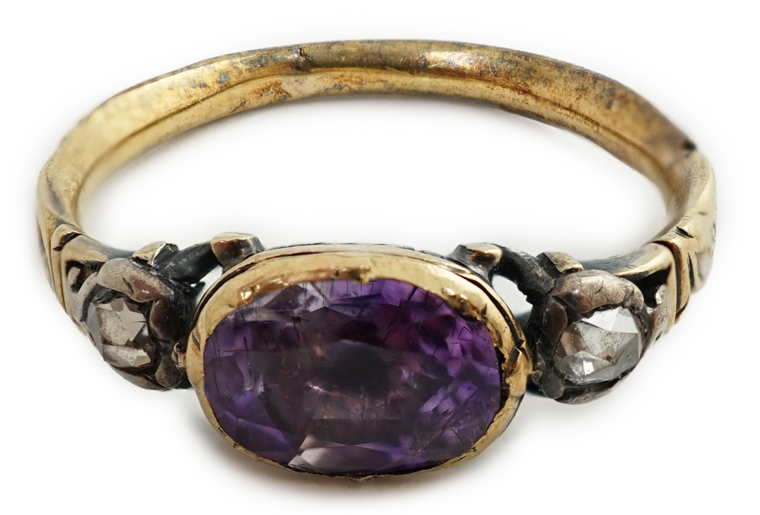 A George III gold, single stone foil backed amethyst and two stone rose cut diamond set memorial ring